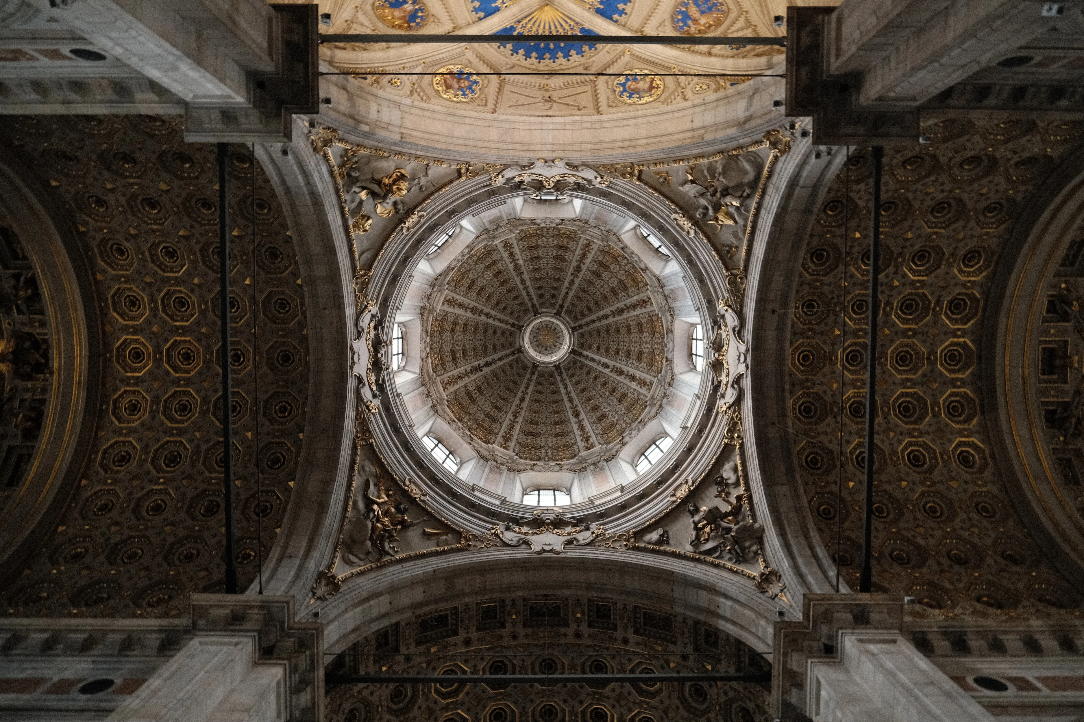 Looking up into the painted dome of a Catholic church