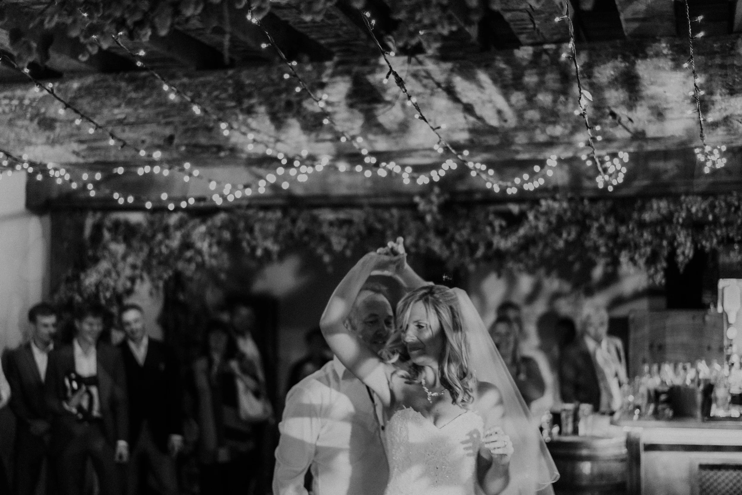Fiona twirls under Mark's arm during their first dance
